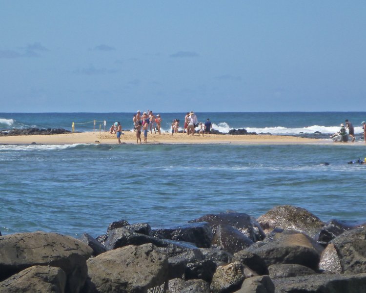 075P1000094.jpg - Poipu Beach Park, Adam wheeling Laura onto the sandbar