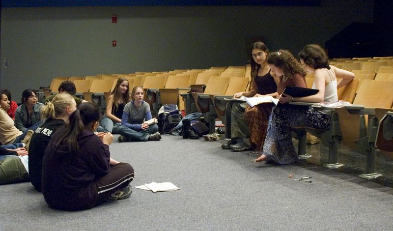 Everyone watches while Erin and Laura follow along carefully